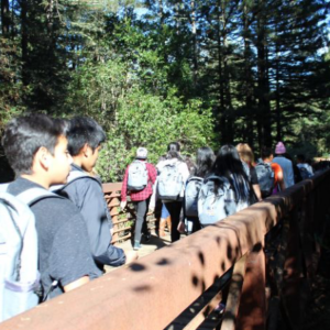 Picture of students crossing a bridge